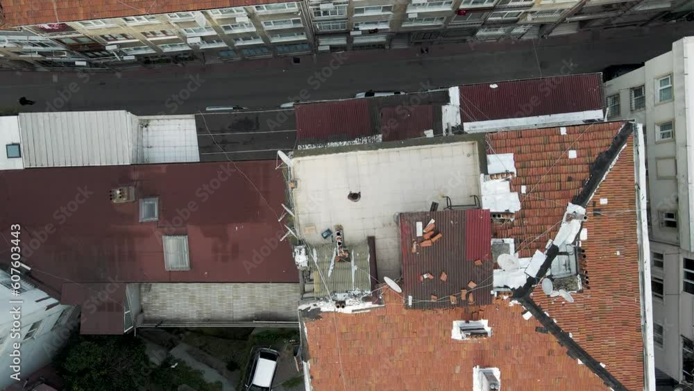 Aerial view of a person on the rooftop in Istanbul high density residential district, Beyoglu district, Turkey. Aerial view of a person on the rooftop in Istanbul high density residential district, Beyoglu district, Turkey.