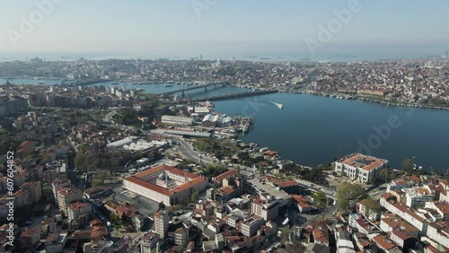 Aerial view of Beyoglu district along the Golden Horn river estuary with Galata bridge and the Ataturk bridge connecting Istanbul European Side, Turkey. photo