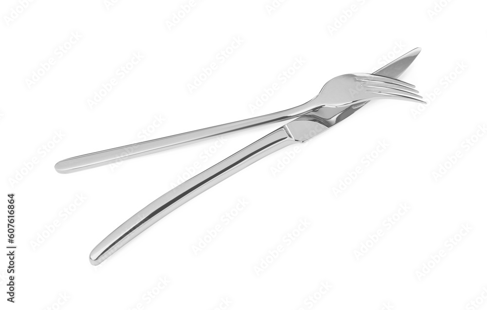 Fork and knife isolated on white. Stylish shiny cutlery set Fork and knife isolated on white. Stylish shiny cutlery set