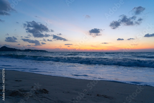 Deserted sandy beach and sea at dawn on a tropical island