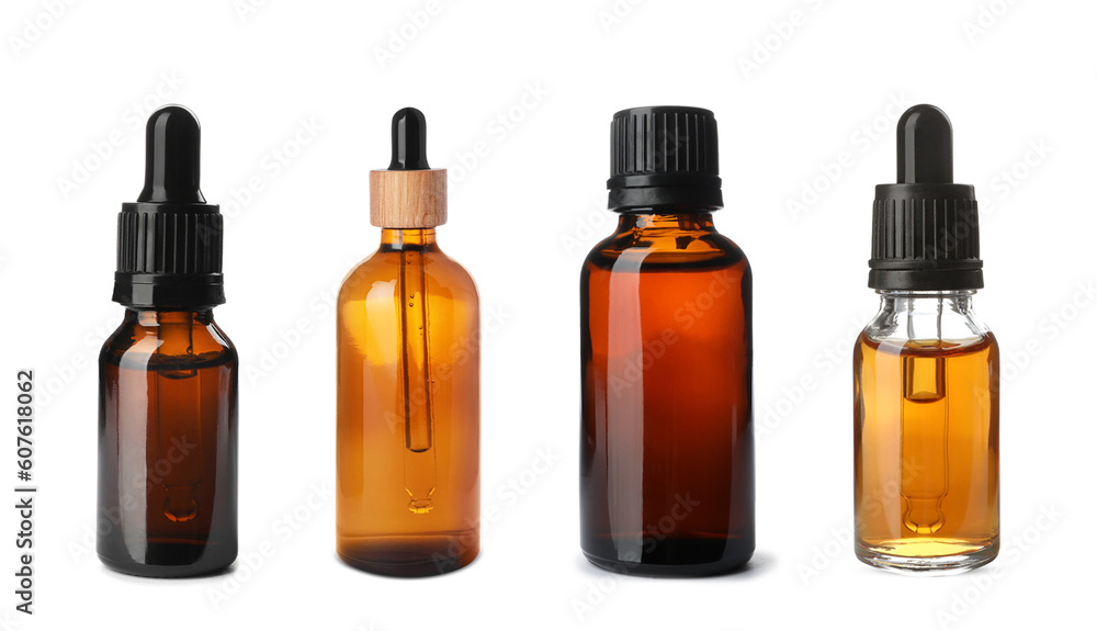Set of different cosmetic oils in bottles on white background Set of different cosmetic oils in bottles on white background