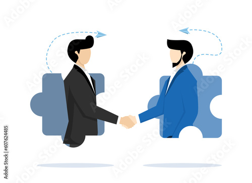 Businessmen shaking hands on a jigsaw puzzle. Business agreement partners or coordination cooperation. Building relationships leads to success. Successful business deals, contracts or negotiations.