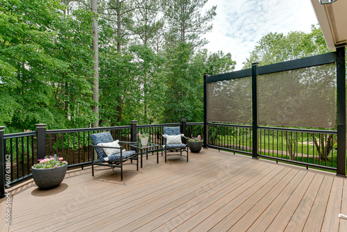  Beautiful Summer Staged Deck with Nature Woods and a Flower Pot and Privacy Screen