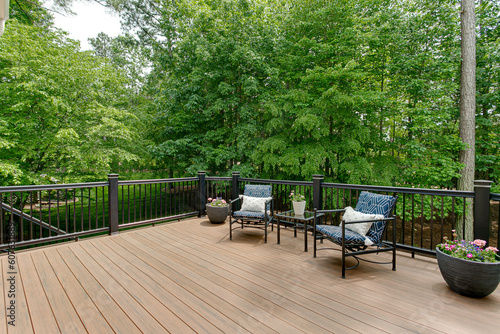 Valokuva Beautiful Summer Staged Deck with Nature Woods and a Flower Pot