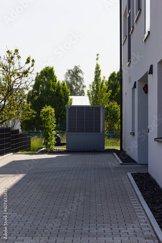 heat pump in a new building area with modern house facades