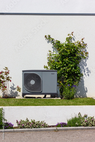 heat pump in a new building area with modern house facades