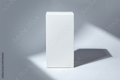 White paper box mockup in sunlight with shadow on white background. © runrun2