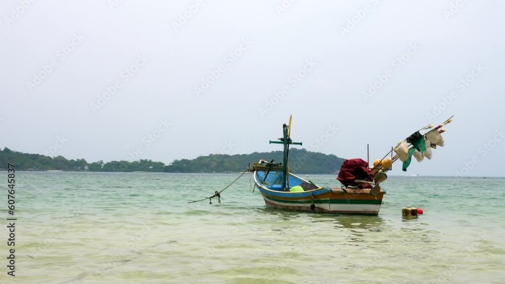 Typical Thai fishing boat on a beautiful clear water island of Koh Samui Typical Thai fishing boat on a beautiful clear water island of Koh Samui