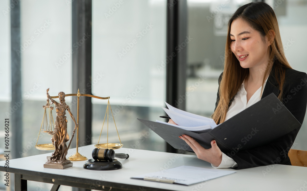 Asian woman lawyer businesswoman Working to view legal documents at the office Asian woman lawyer businesswoman Working to view legal documents at the office