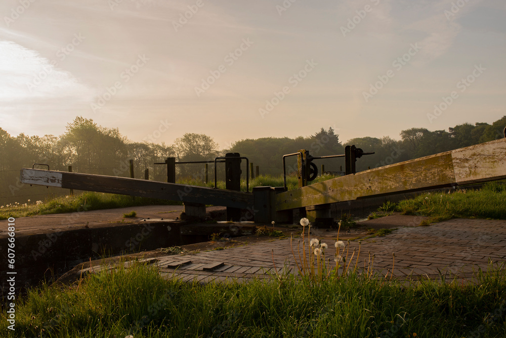 Canal lock gate on a sunny misty morning. Tyrley Locks on the Shropshire Union Canal. Canal lock gate on a sunny misty morning. Tyrley Locks on the Shropshire Union Canal.