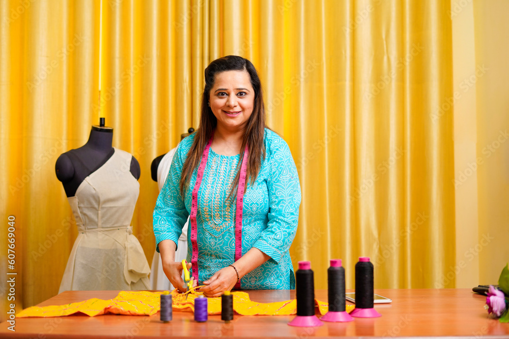 Confident indian female designer standing at office Confident indian female designer standing at office
