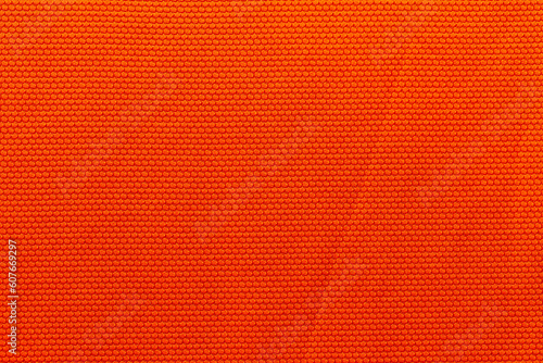 Orange color sports clothing fabric football shirt jersey texture and textile background. © Southtownboy Studio