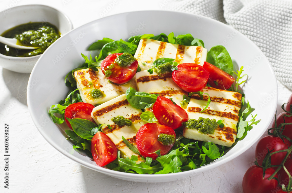 Grilled Halloumi Cheese with Cheery Tomatoes and Pesto with Arugula, Spinach, and Basil, Ketogenic Paleo Diet Lunch Grilled Halloumi Cheese with Cheery Tomatoes and Pesto with Arugula, Spinach, and Basil, Ketogenic Paleo Diet Lunch