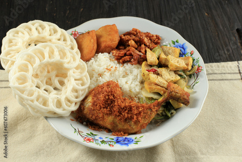 Nasi Warteg with Fried Chicken Lengkuas photo