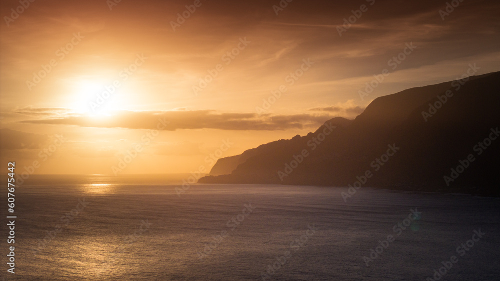 Golden Horizon: Aerial Drone Perspective of Sunset on Madeira Coastline Golden Horizon: Aerial Drone Perspective of Sunset on Madeira Coastline