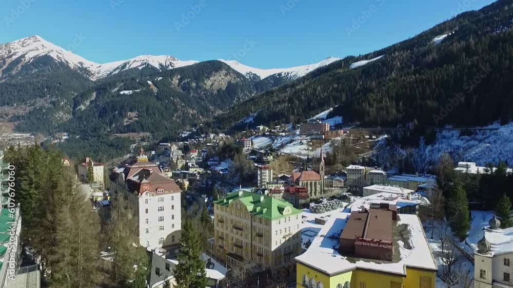 Drone forward wide shot over rooftop with buildings in snowy bad gastein,austria Drone forward wide shot over rooftop with buildings in snowy bad gastein,austria