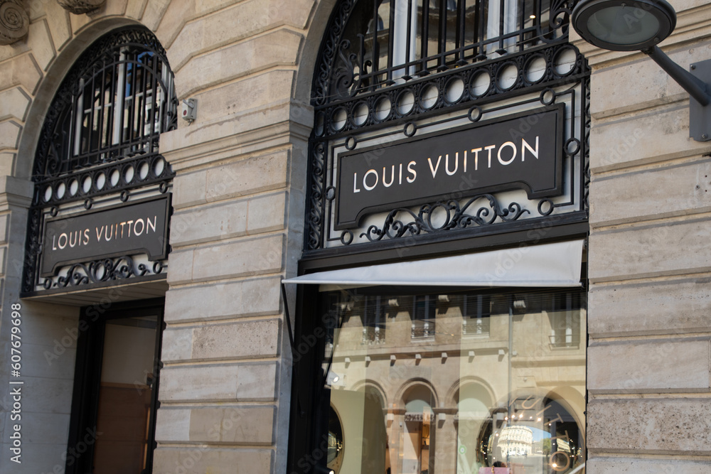 louis vuitton logo brand wall facade and sign text front entrance