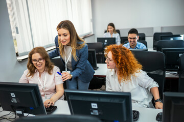 Educator and students in programming school