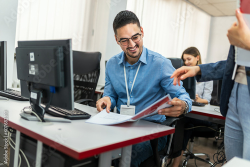 Educator and students in programming school