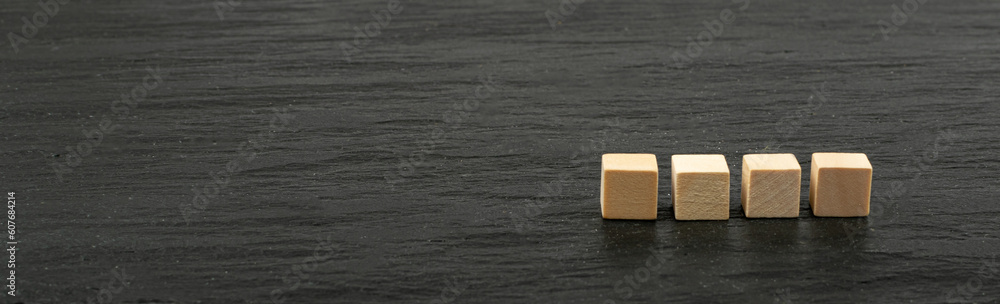 Four Cubes on a Black Stone Background, Word of 4 Letters Mockup Four Cubes on a Black Stone Background, Word of 4 Letters Mockup