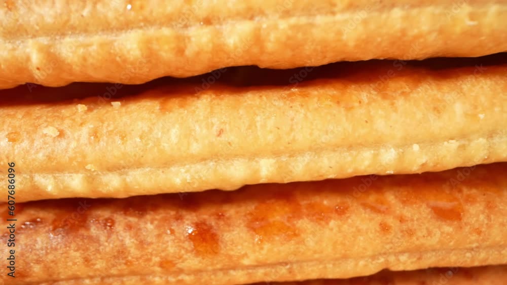 Prepare to be captivated by a deliciously enticing macro video. Sugar-coated biscuits glisten like precious jewels, their irresistible charm beckoning you closer. food and dessert concept. 4K HDR
Prepare to be captivated by a deliciously enticing macro video. Sugar-coated biscuits glisten like precious jewels, their irresistible charm beckoning you closer. food and dessert concept. 4K HDR
