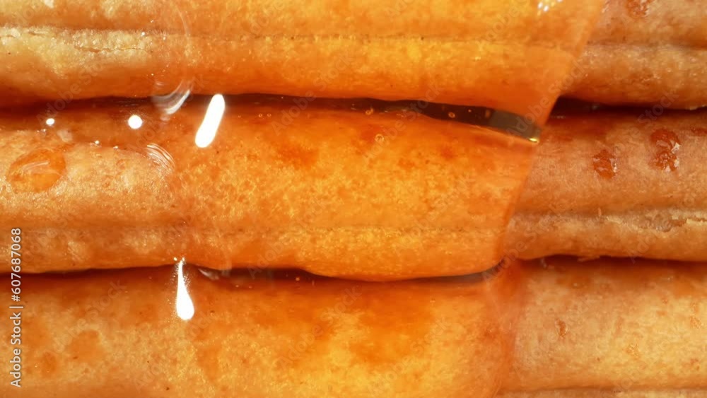 Watch as golden honey gracefully pours over sugar-coated biscuits, creating a tantalizing display of art and sweetness. Each droplet and crystalline texture is beautifully captured. 4K Footage
Watch as golden honey gracefully pours over sugar-coated biscuits, creating a tantalizing display of art and sweetness. Each droplet and crystalline texture is beautifully captured. 4K Footage