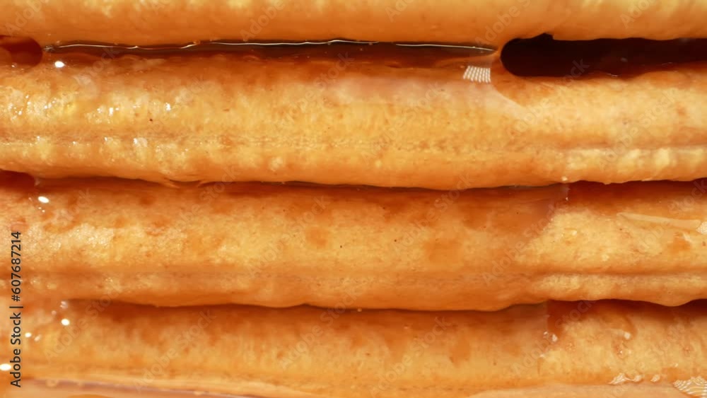 Honey, with its rich golden hue and velvety texture, glides effortlessly over the surface of the sugar-coated biscuits, creating a mesmerizing spectacle. As it gracefully cascades down the sides.
Honey, with its rich golden hue and velvety texture, glides effortlessly over the surface of the sugar-coated biscuits, creating a mesmerizing spectacle. As it gracefully cascades down the sides.