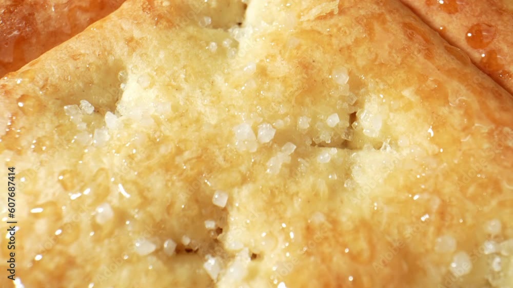 Watch in awe as the camera zooms in on delicate sugarcoated biscuits