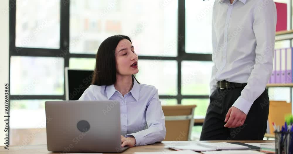 Interested curious corporate spy looking at colleague laptop. Manager deceives and steals idea and partner Interested curious corporate spy looking at colleague laptop. Manager deceives and steals idea and partner