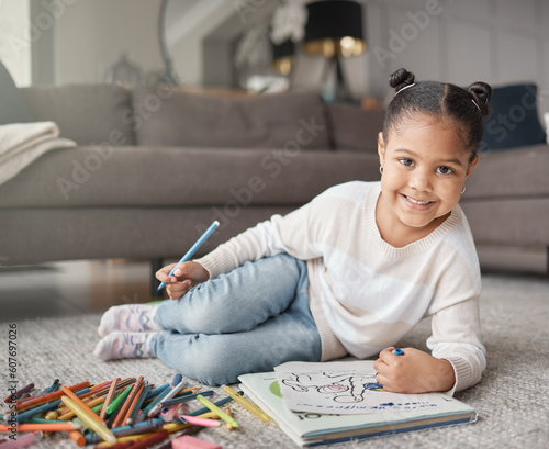 Portrait of happy kid, girl and pencils for coloring on living room floor for education, learning and creative development. Cute child, books and crayons for writing, drawing and creativity of art