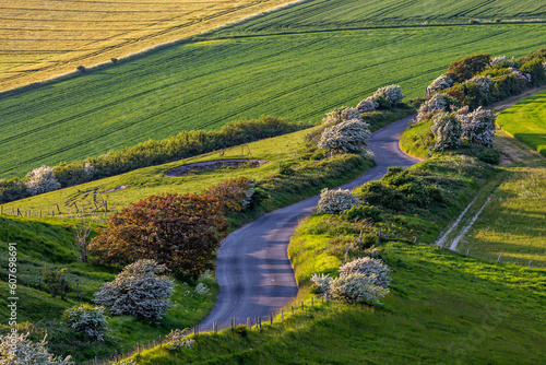 Looking down at a country road in the South Downs, with farmland surrounding