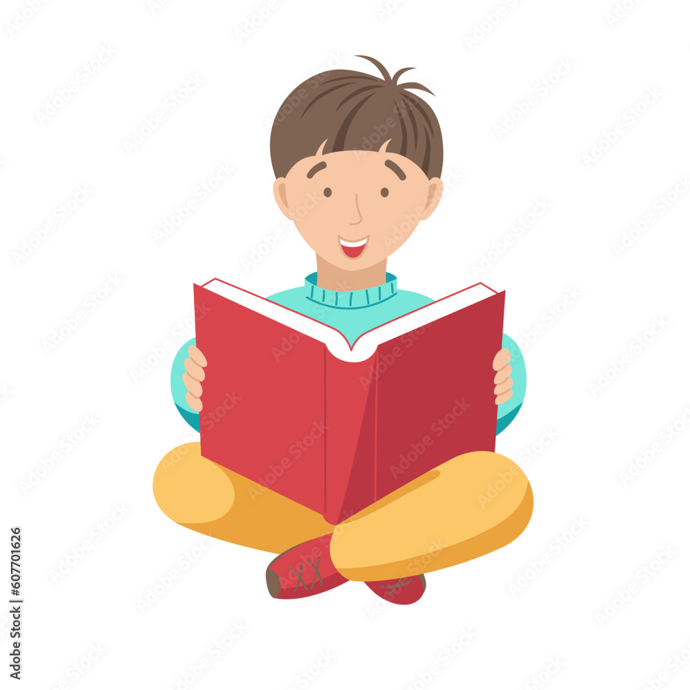 The boy happily looks into the book The boy happily looks into the book