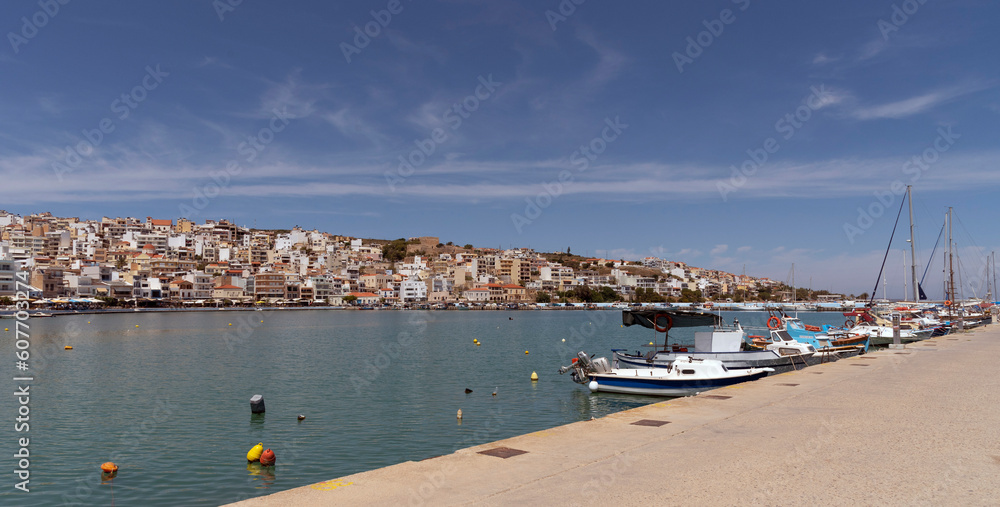 Sitia, Eastern Crete, Greece, Europe. 2023,  Waterfront of Sitia harbour in Eastern Crete with its small boats, hotels and restaurants on the seafront.