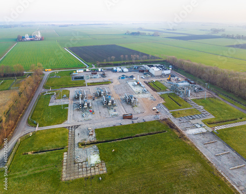 Overschild, Netherlands - 14 Feb 2023: Aerial view of gas extraction site being dismantled because gas extraction is terminated as it triggered earthquakes, Overschild, Groningen, The Netherlands. photo