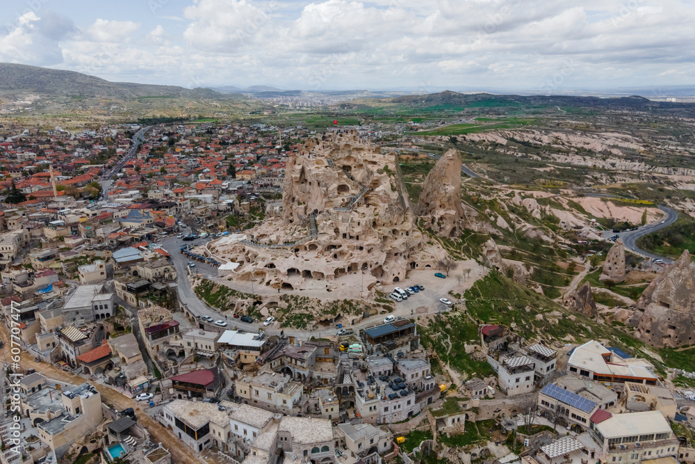 Aerial view of Uchisar Castle in Uchisar old town, carved with caves and numerous tunnels, Cappadocia, Nevsehir, Turkey. Aerial view of Uchisar Castle in Uchisar old town, carved with caves and numerous tunnels, Cappadocia, Nevsehir, Turkey.