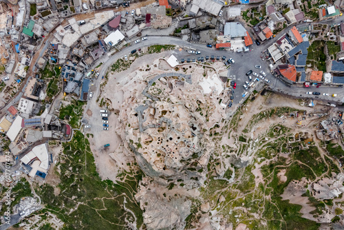 Aerial view of Uchisar Castle in Uchisar old town, carved with caves and numerous tunnels, Cappadocia, Nevsehir, Turkey. photo