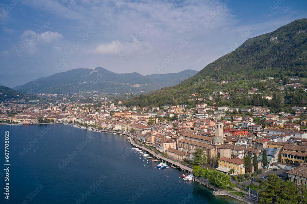 Tourist site on Lake Garda. Lake in the mountains of Italy. Aerial view of the town on Lake Garda. View of the historic part of Salò on Lake Garda Italy.
