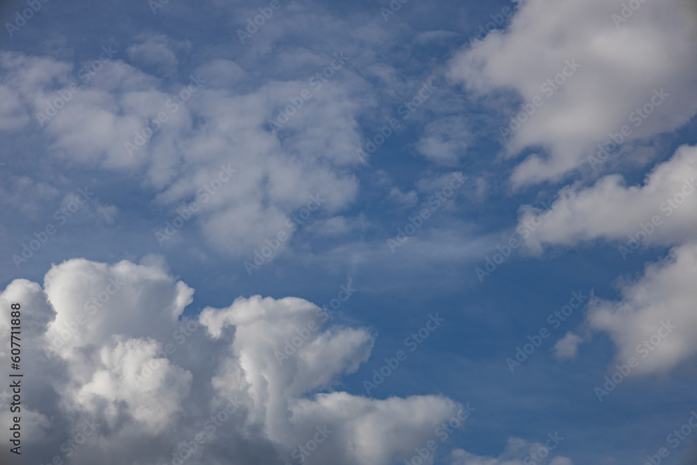 A beautiful clouds against the blue sky background. Clouds in the sky. Beautiful natural pattern in the sky. A beautiful clouds against the blue sky background. Clouds in the sky. Beautiful natural pattern in the sky.