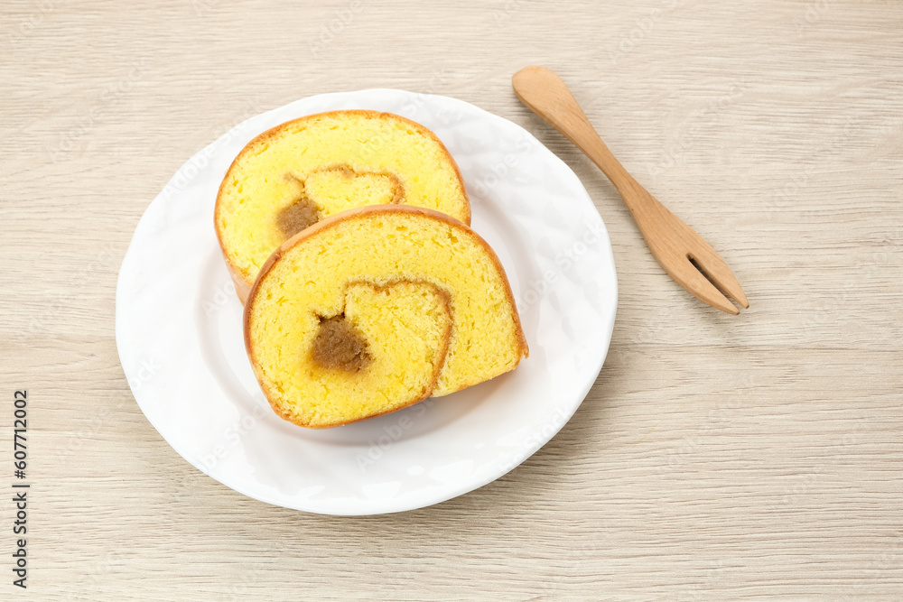 Bolu Gulung Nanas or Slice Pineapple Roll Cake served on white plate
Bolu Gulung Nanas or Slice Pineapple Roll Cake served on white plate