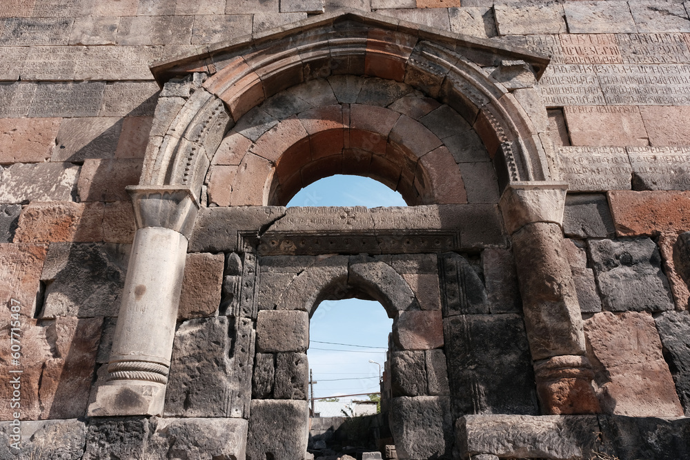 Portal of Avan Cathedral (VI century, the oldest surviving church in the city limits) on sunny day. Yerevan, Armenia.