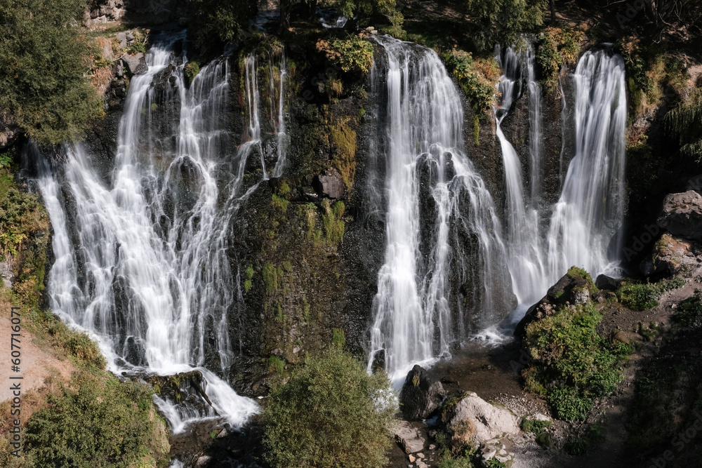 Long exposure shot of Shaki waterfall on sunny summer day. Syunik Province, Armenia.