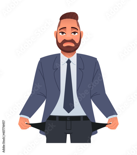 A sad businessman with empty pockets. No money. A guy with his pockets turned out. A boy without money.