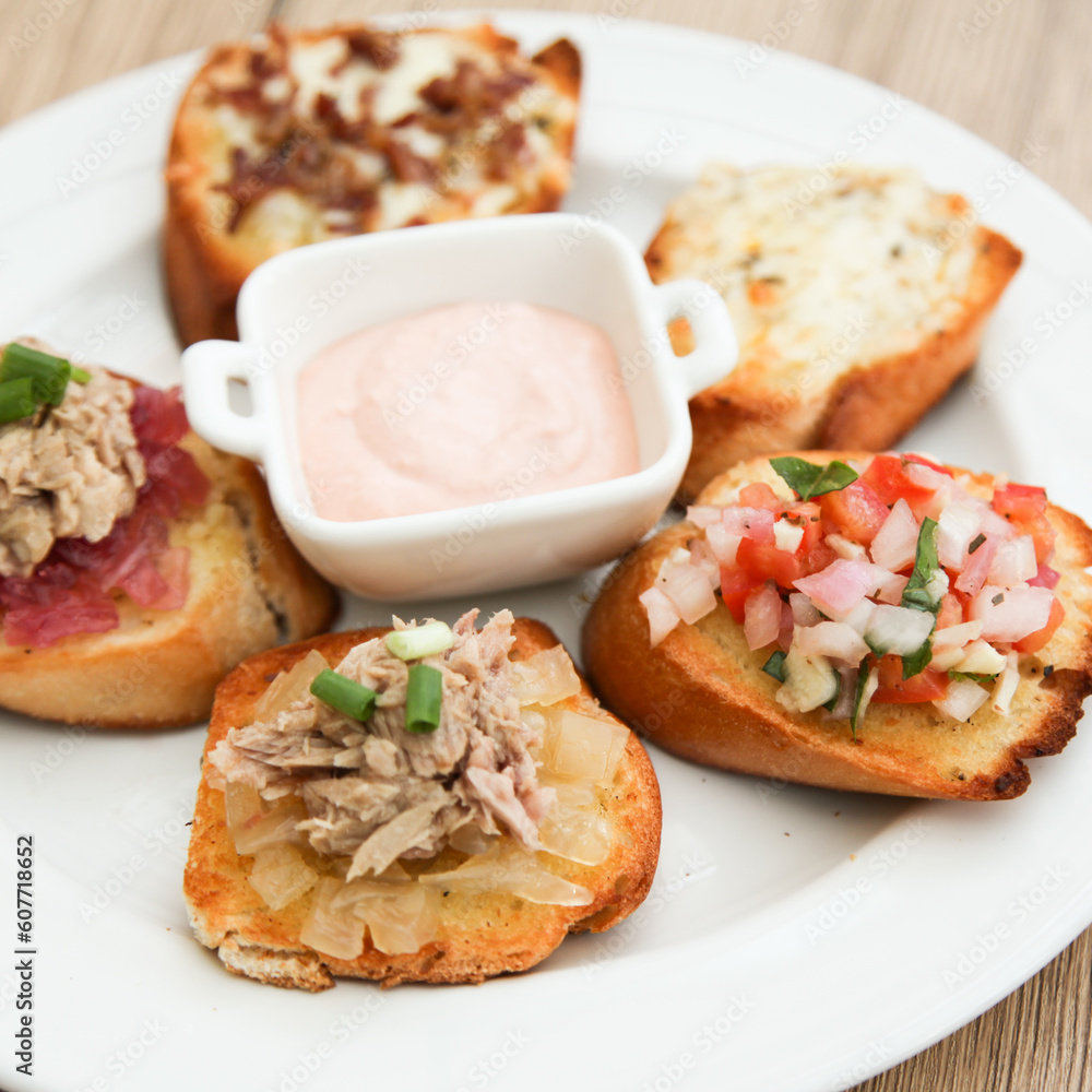 5 kinds of bruschetta served with Belgian Andalouse sauce 5 kinds of bruschetta served with Belgian Andalouse sauce