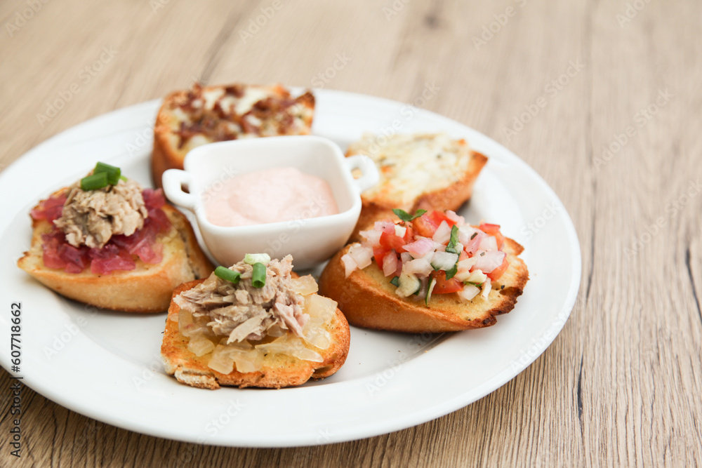 5 kinds of bruschetta served with Belgian Andalouse sauce 5 kinds of bruschetta served with Belgian Andalouse sauce