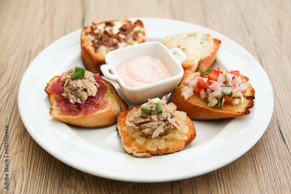 5 kinds of bruschetta served with Belgian Andalouse sauce 5 kinds of bruschetta served with Belgian Andalouse sauce