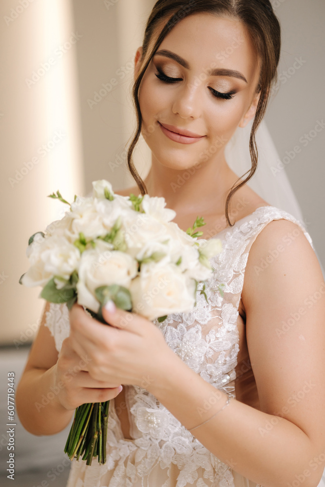 Naklejka premium Portrait of gorgeous bride with beautiful wedding bouquet. Morning of bride. Wedding day.