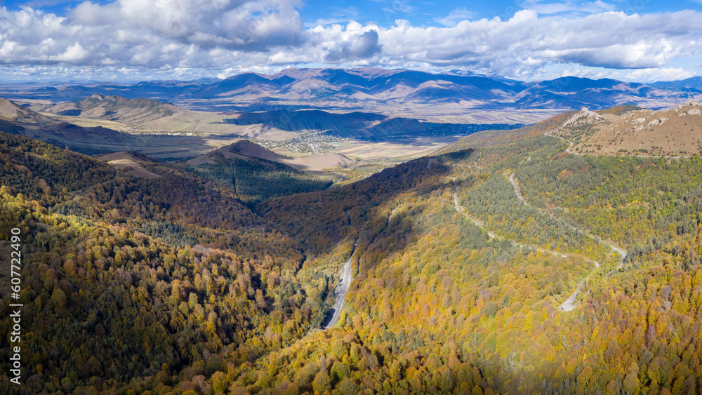 Panoramic drone view of the road to Pushkin pass and Dzoraget valley on sunny autumn day. Lori Province, Armenia.