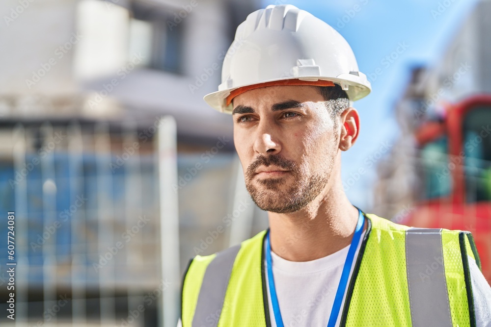 Young hispanic man architect standing with relaxed expression at street Young hispanic man architect standing with relaxed expression at street