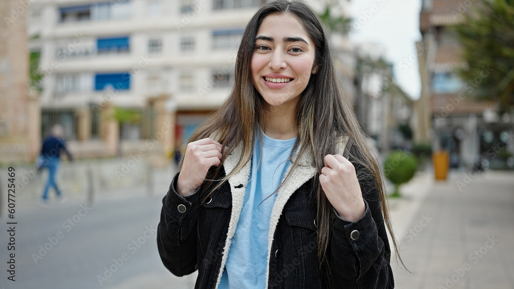 Young beautiful hispanic woman student smiling confident standing at street Young beautiful hispanic woman student smiling confident standing at street