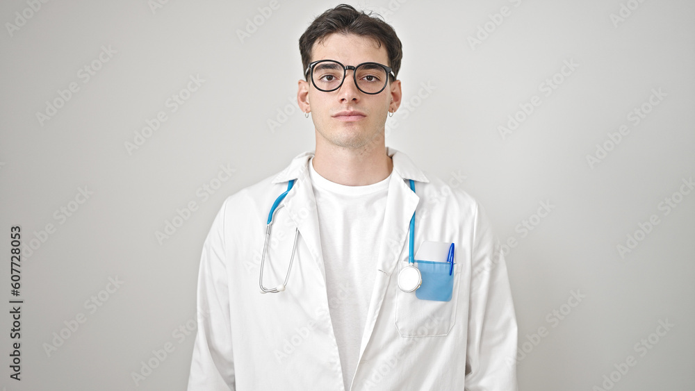Young hispanic man doctor standing with serious expression over isolated white background Young hispanic man doctor standing with serious expression over isolated white background